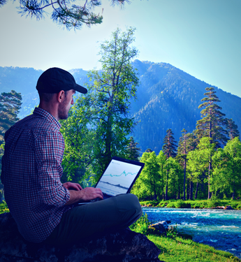 man-working-forest-with-laptop